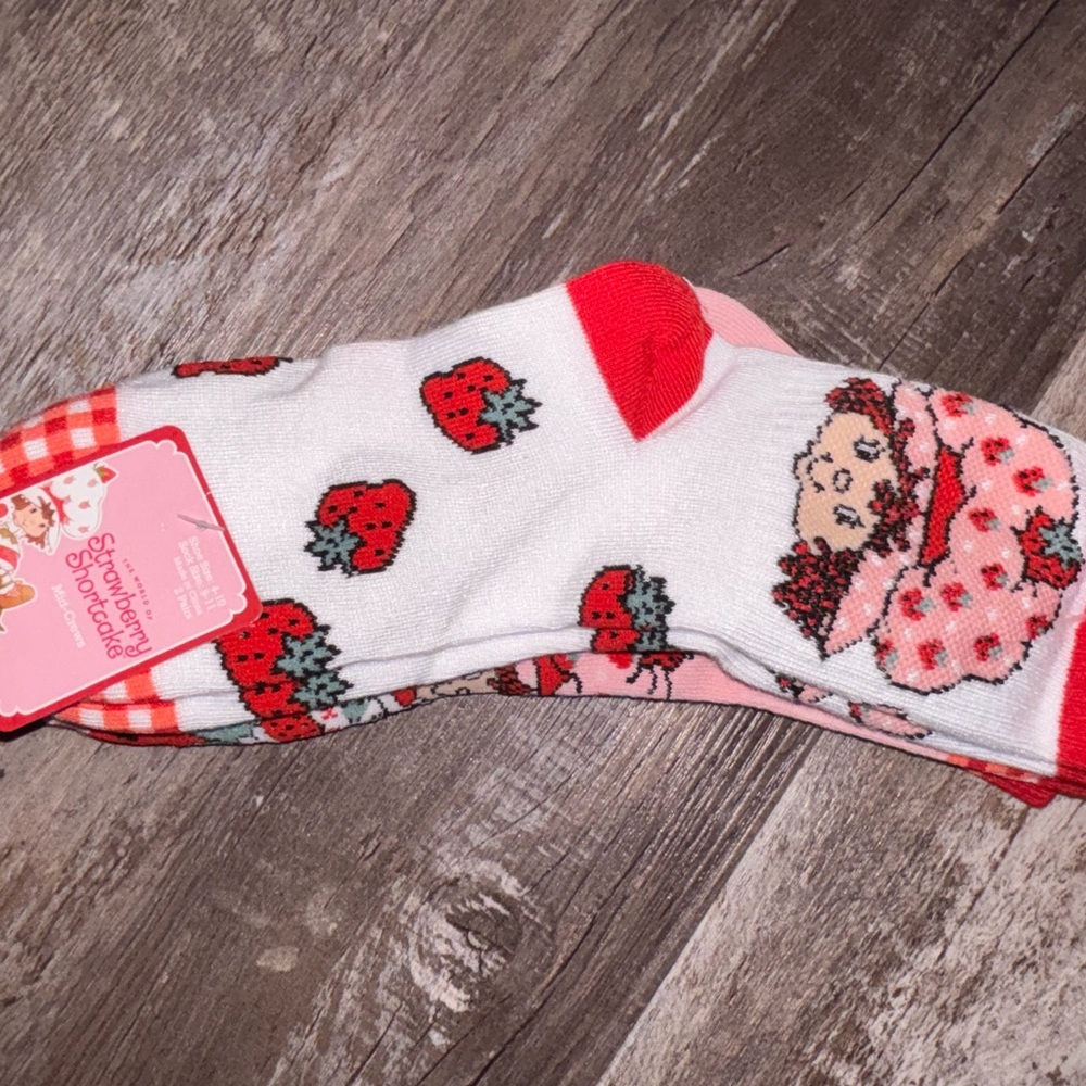 Two pairs of strawberry shortcake socks